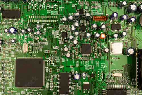 A close-up of a circuit board with microchips from an electrical appliance or computer. Concept of modern technology. Concept of electronics and microchips.