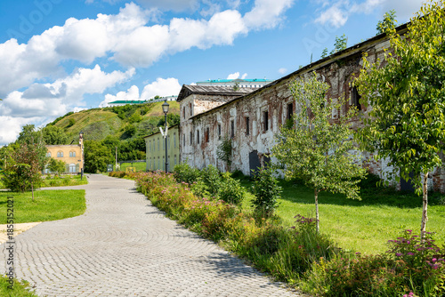A street in a recreation park in a small Siberian town, bathed in autumn sunshine. Tourism in Russia