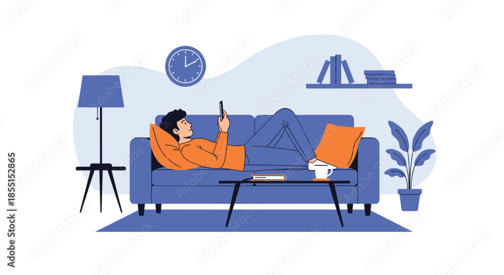 Obraz premium Young man relaxing on a comfortable blue sofa and using his smartphone in a cozy living room with plants and a lamp.