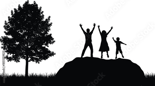 Happy family silhouette celebrating together on hill near tree, parents and child jumping with raised hands, success freedom concept