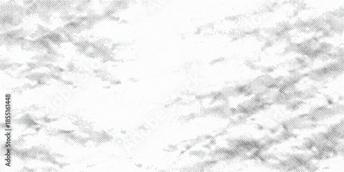 A white marble texture blends with a black and white abstract background to create a cold winter stone pattern featuring gray grunge cement and textured snow surfaces