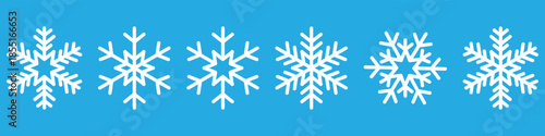 White snowflake line icons set isolated on blue background. Winter, cold, frost and weather symbols. Editable stroke vector icons for seasonal design, Christmas, holiday graphics, decorative projects.