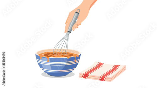 Human hand holding a whisk vigorously mixing batter in a blue striped bowl, placed next to a neatly folded kitchen towel.
