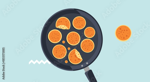 Several golden brown pancakes cooking in a black frying pan viewed from above, with one pancake placed to the side.