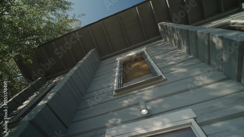 Modern rustic two-storey wooden house. Camera in motion