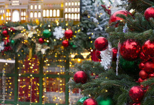 New Year's Eve decoration of street. Christmas trees with balls on branches.