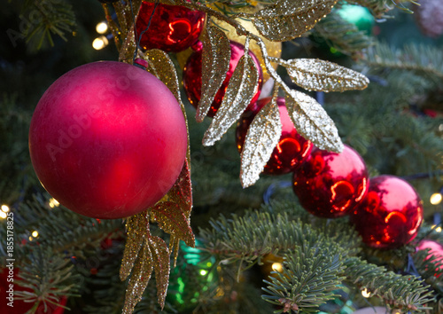 New Year's Eve decoration of street. Christmas trees with balls on branches.