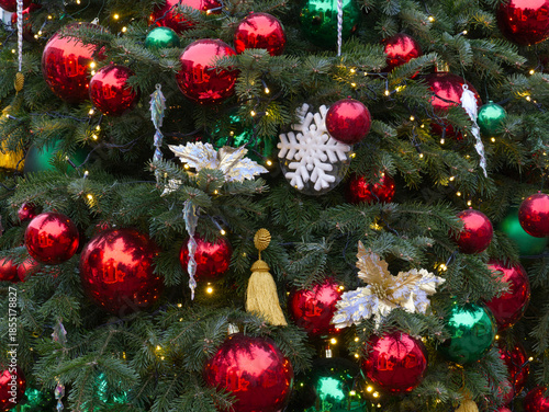 New Year's Eve decoration of street. Christmas trees with balls on branches.