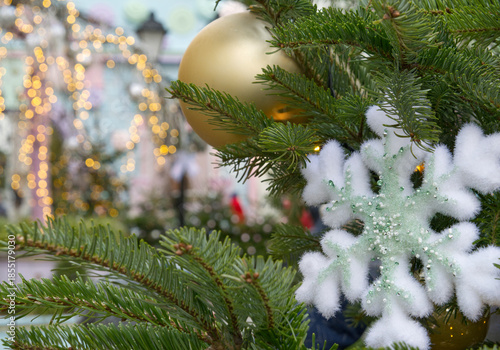 New Year's Eve decoration of street. Christmas trees with balls on branches.