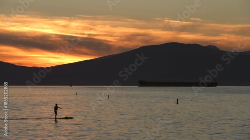 Sunset English Bay Paddle Boarding Vancouver 4K UHD.Sunset paddle boarding on English Bay. Vancouver, British Columbia, Canada. 4K, UHD.
