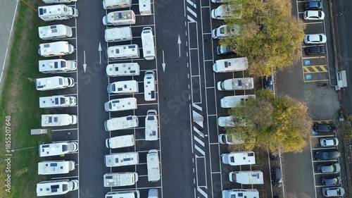 Aerial view highlighting numerous camper vans parking facility in Lombardy, Italy