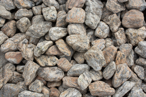 Smooth white garden pebbles texture with dark border background