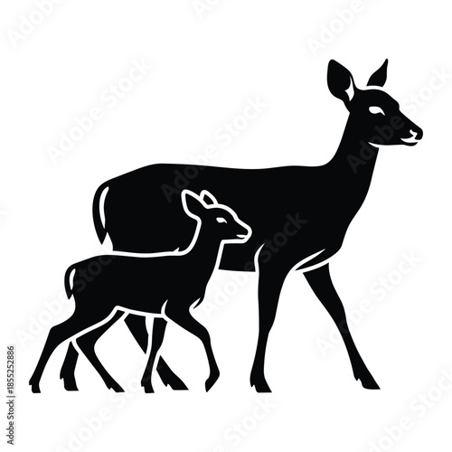 A mother deer and her fawn walking together in silhouette