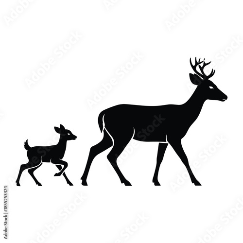 Deer and fawn silhouette walking together in nature