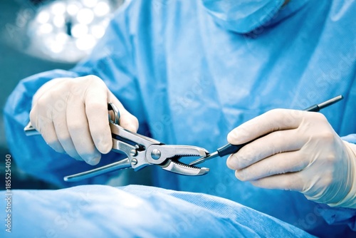 A dentist is holding a pair of pliers and a toothbrush