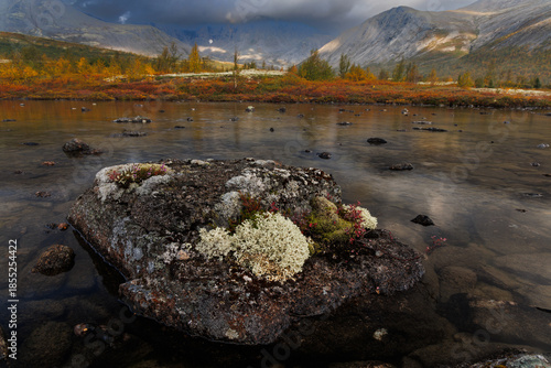 Autumn Mountain Lake Landscape With Reflections, Large Rocks, and Calm Water in Remote Valley