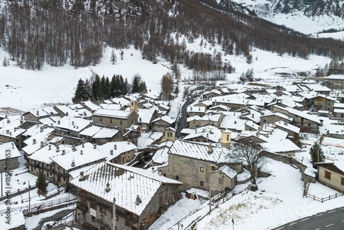 Aerial view of Chianale during winter season, a typical alpine village in Piedmont region, Italy