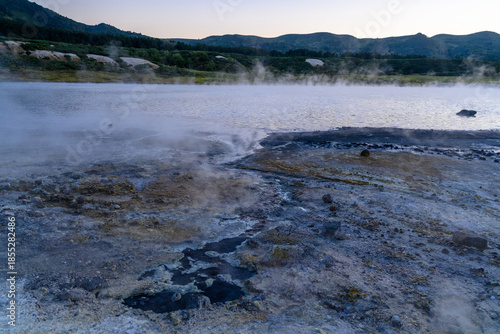Mysterious hot springs dance in twilight at a remote Russian landscape