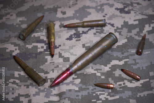 gun ammo on camouflage background