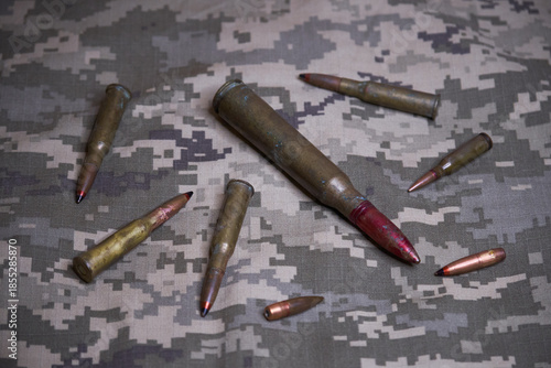 gun ammo on camouflage background
