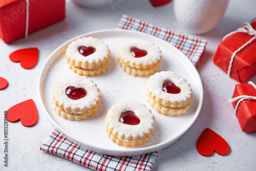 Linzer cookies with strawberry jam and heart shape topping for Valentine's day holiday