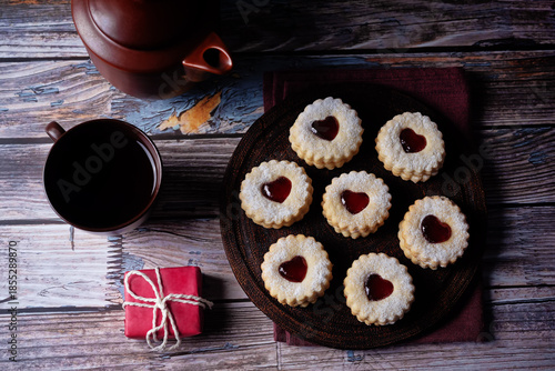 Linzer cookies with strawberry jam and heart shape topping for Valentine's day holiday