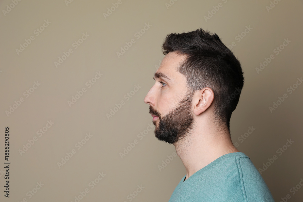 Fototapeta premium Profile portrait of man on grey background. Space for text