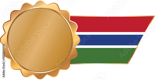 A shiny gold award seal featuring a circular metallic center with a flag of Gambia on ribbon with gold outline