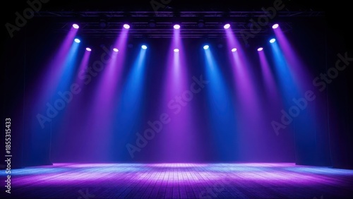 Vibrant stage lights illuminate empty theater