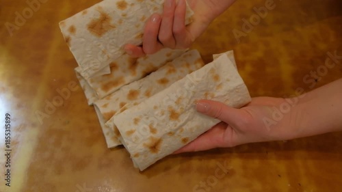 hand holding a slice of bread