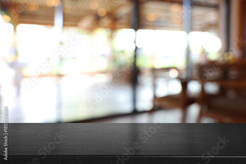 Wallpaper Mural Empty table and blurred bar interior. Space for design Torontodigital.ca