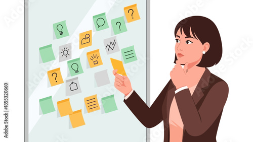 Businesswoman analyzing sticky notes on board for creative planning and strategy