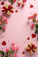 Romantic vertical scene with pink roses, gift boxes tied with red ribbons, and scattered heart shapes on a soft pink backdrop, ideal for Valentine Day greeting and romance themed promotions