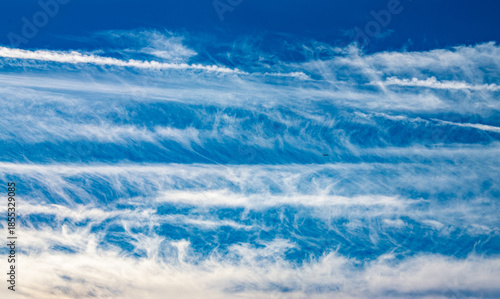 layers of white clouds in a blue sky