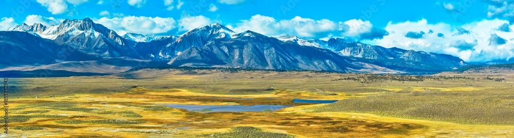 Fototapeta premium Aerial Panorama of Snow Capped Mountains and Golden Valley Eastern Sierra California
