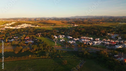aerial view of a sunrise in Sao Jose dos Campos city with beautiful blue and orange sky in the countryside of Brazil. Astonishing landscape and the city scape in the distance.
