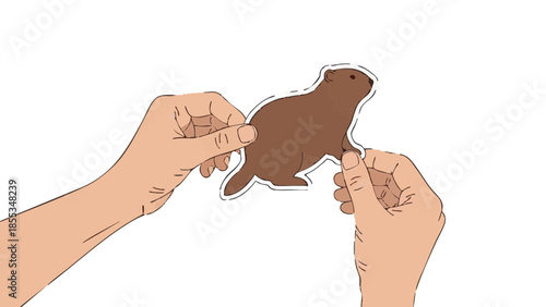 Hands holding a groundhog cutout for the concept of Groundhog Day  