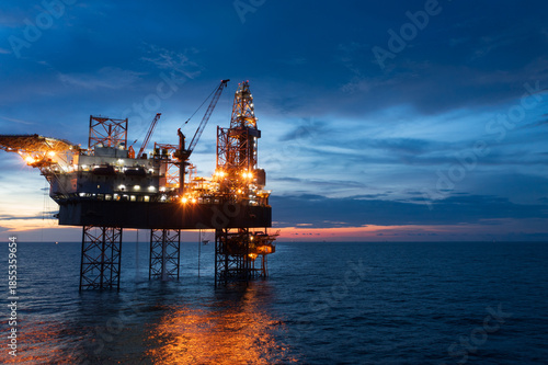 Foto Aerial view of offshore jack up rig in a shipyard during sunset for oil and gas exploration and production
