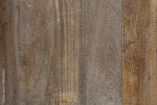 Natural dark wood texture background with vertical grain patterns and rustic weathered surface.
