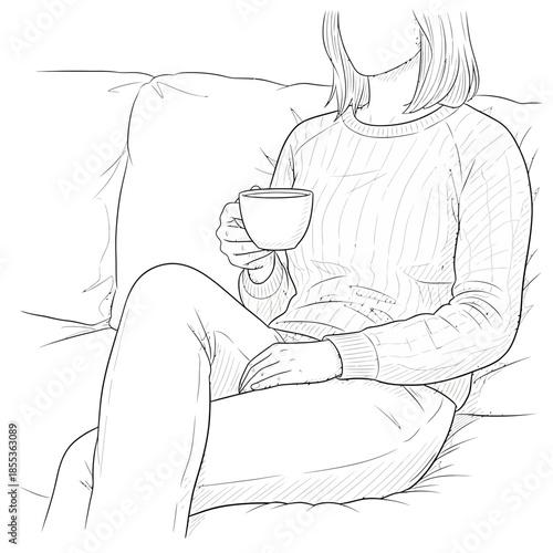 Woman Relaxing on Sofa with a Cup of Hot Beverage, Cozy Home Scene
