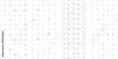 Abstract gray and white textured pattern resembling scattered pebbles or paint splatters