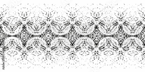 Intricate black and white symmetrical pattern resembling floral or shell shapes