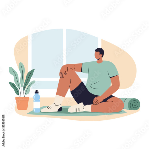 Man sitting on yoga mat with water bottle and plant, relaxing after workout