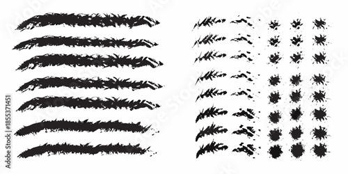 Abstract black brush strokes and scattered speckles on a white background