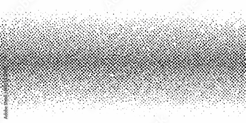 A grayscale image displaying a dense field of scattered dots and grainy texture
