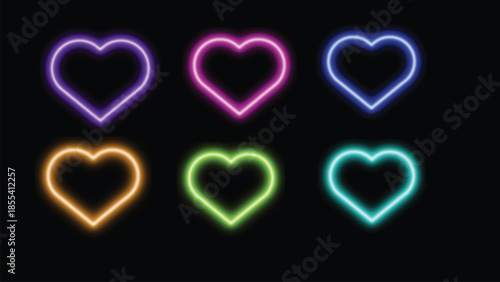 Neon hearts in vibrant purple pink blue orange green and teal illuminate a dark background