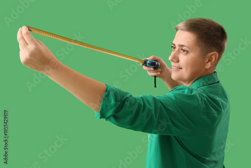 Young woman with tape measu...