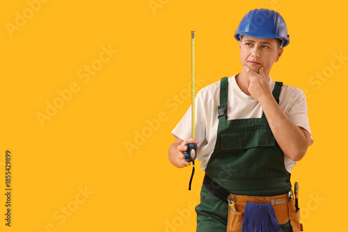 Thoughtful female worker wi...