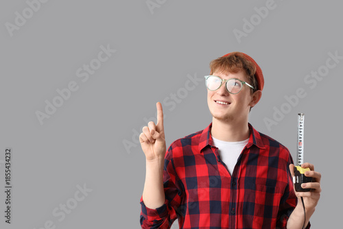 Young man with measuring ta...