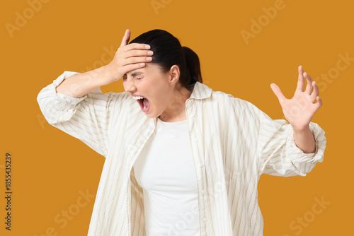 Screaming young woman on or...